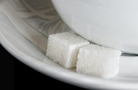 White Cube Sugar near of a bowl