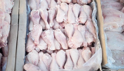 frozen chicken drumsticks inside plastic bag and brown carton box ready to export