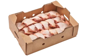 raw peel chicken breasts in half pieces arranged inside brown carton box ready to freeze for export