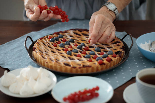 Senior woman at home Senior woman at home powdered sugar for cooking and baking stock pictures, royalty-free photos & images